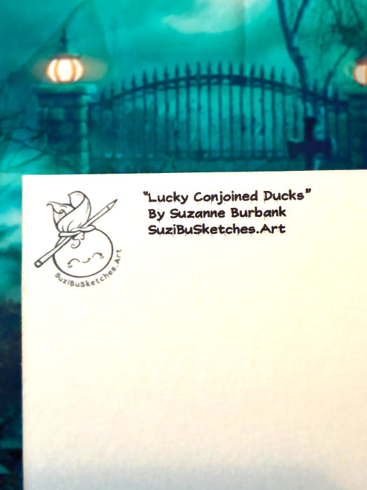 A square art print or card featuring the title "Lucky Conjoined Ducks" by Suzanne Burbank and SuziBuSketches.Art, with a small duck-and-pen illustration on the left and blank white space on the right, set against a teal-toned background with a gate and lantern.