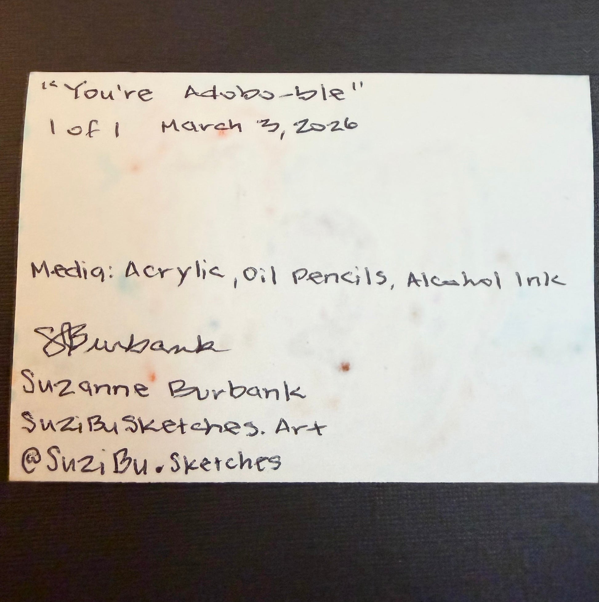 Signed back of ACEO of cartoon-style Filipino lumpia and chicken adobo karaoke singing on the beach. ACEO by Suzanne Burbank | SuziBu.Sketches